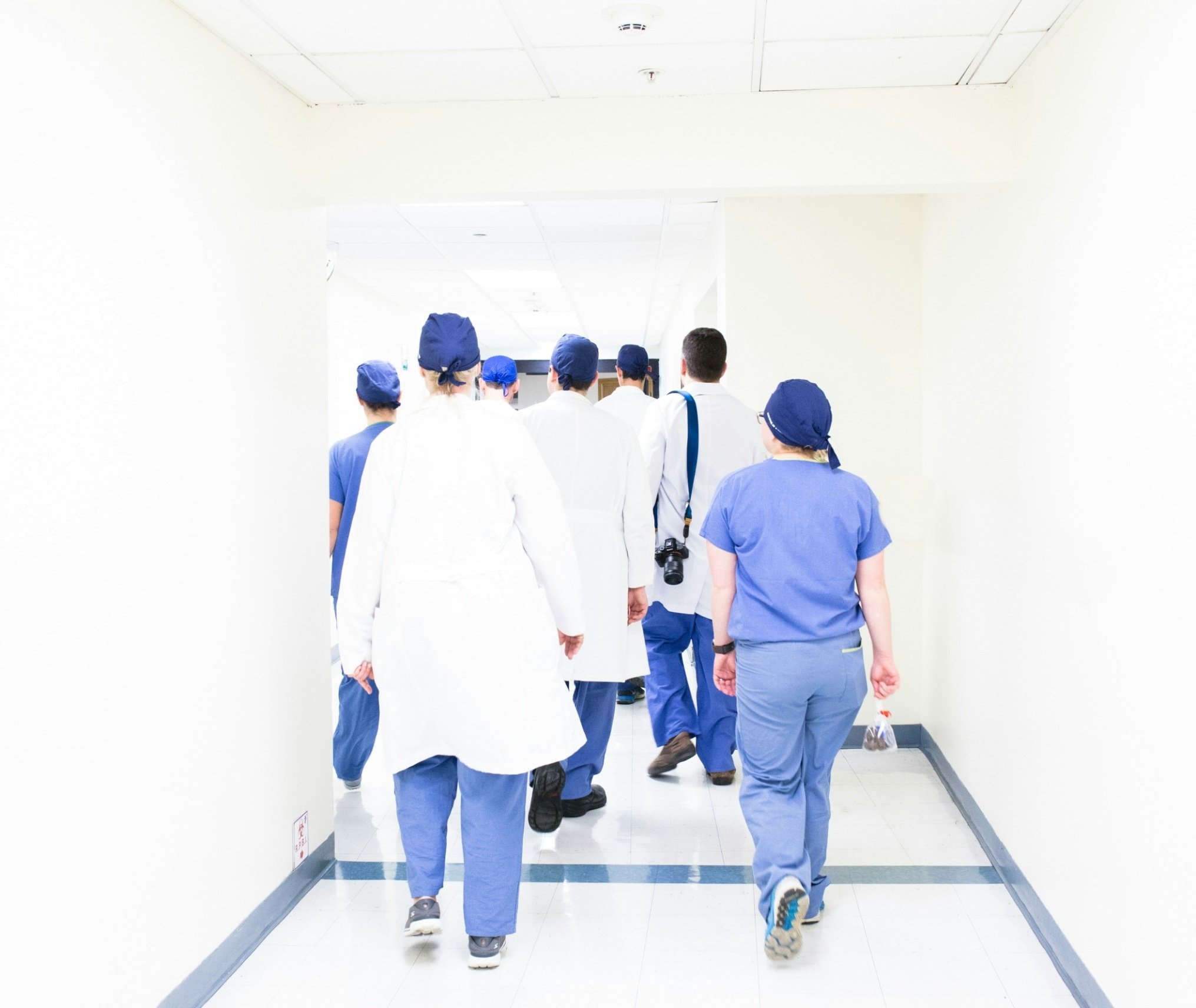 SANE nurses and medical staff walking down a hospital corridor.